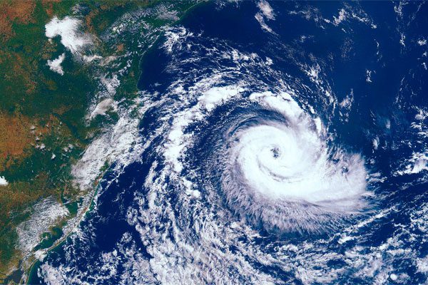 Photo of a hurricane approaching the American continent visible over the land