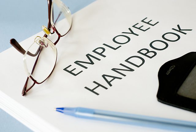 Close up image of employee handbook