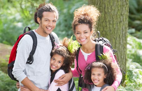 Family hiking, smiling posed for the photo