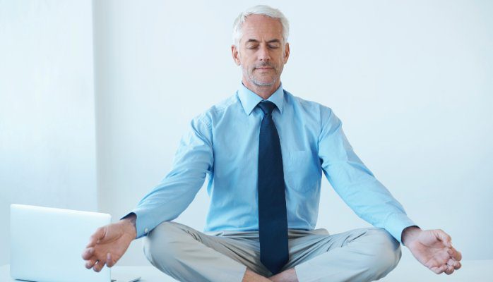 Man meditating at work