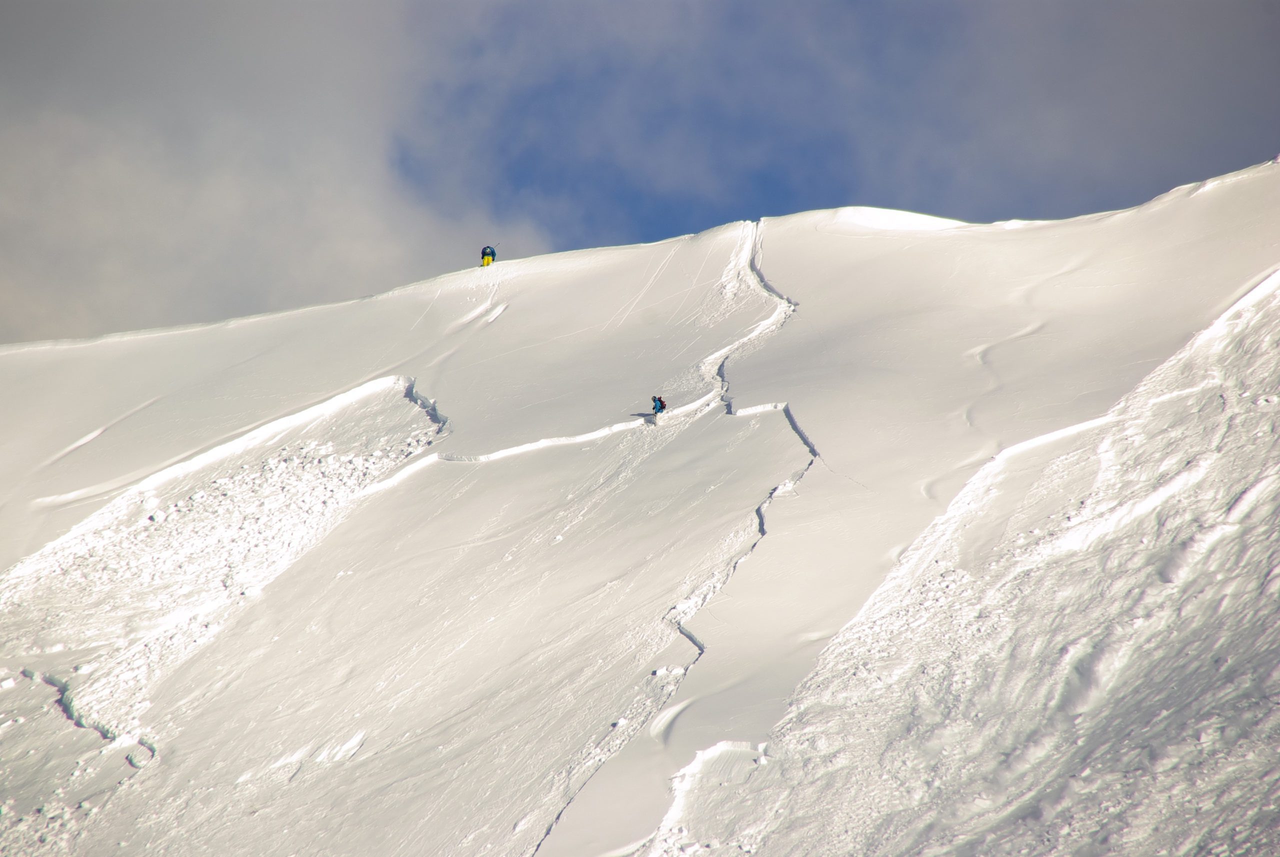 Man skiing down snow covered mountain