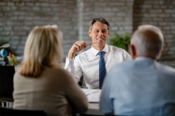FCC-Duble-OHearn-Private-Client-Group-for-Advisors-Image Image of a financial advisor with two middle aged clients