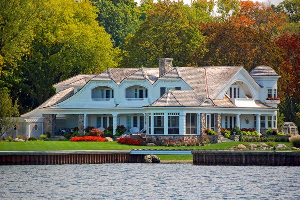 FCC-Duble-OHearn-Private-Client-Group-for-Individuals-Image Image of a large house on a lake or river