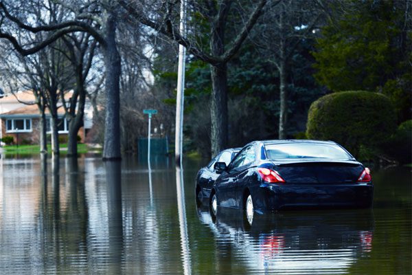 Image of two cars on a flooded street